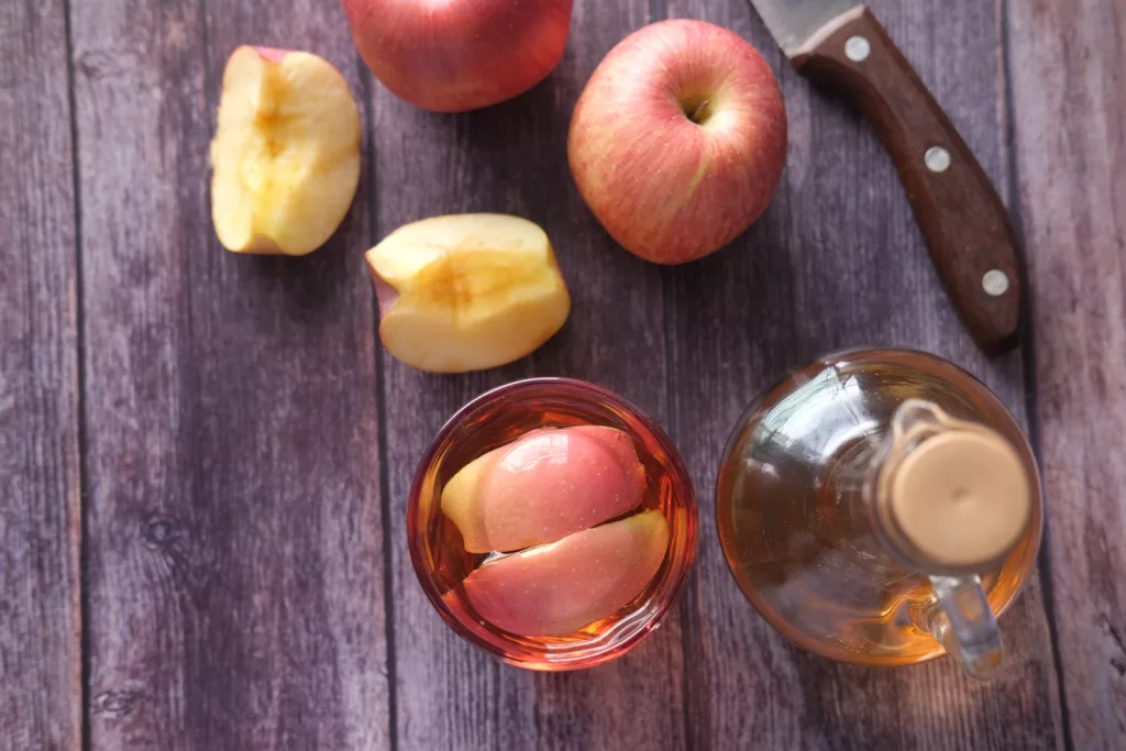 sliced apple beside black handled knife, natural treatments for gout attacks