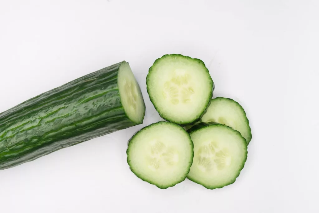 sliced cucumber on white surface, combine watermelon and cucumber