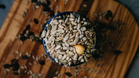 brown nuts on black cup, super seeds