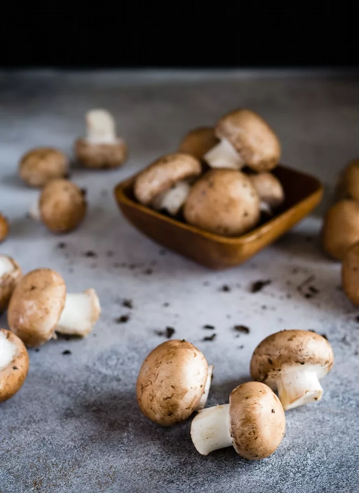 brown mushrooms on gray surface, health benefits of mushrooms