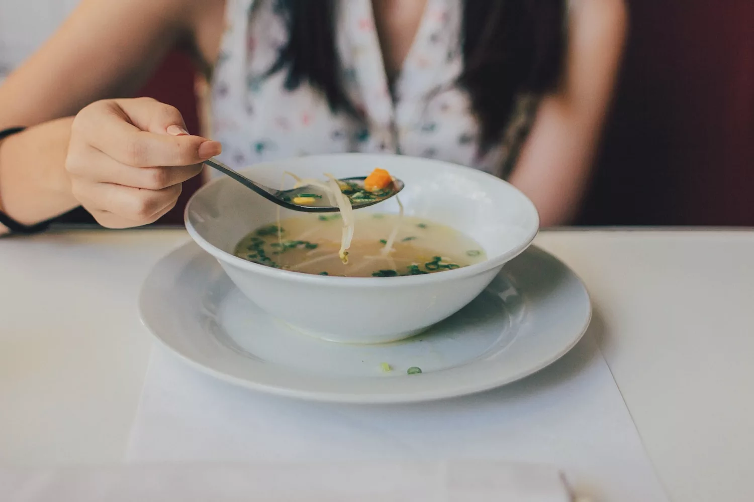 white ceramic bowl, vegetable broth to boost your immune system