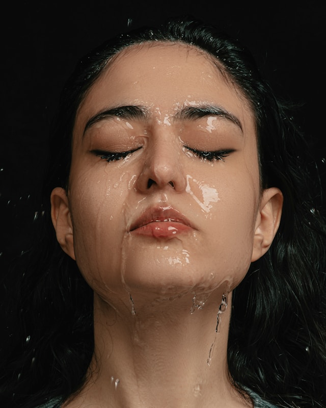 10 Powerful Aloe Vera Benefits on Face You Should Know Today 1 a woman with her eyes closed covered in water, aloe vera benefits on face