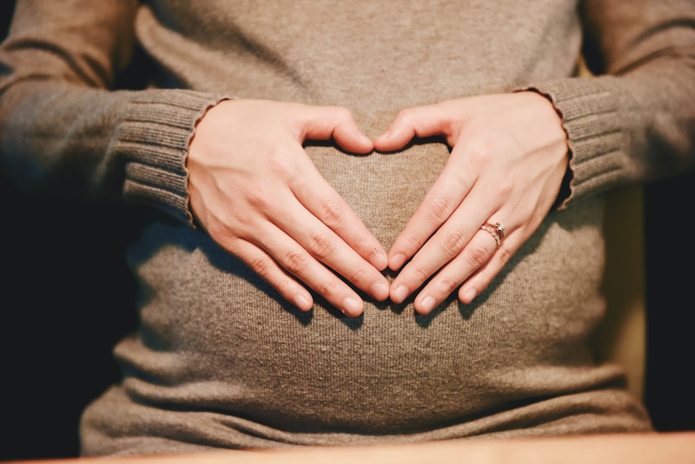 Century Plant Health Benefits: From Skin Care to Digestion Support 4 person holding belly photo