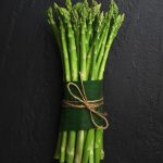 green and brown plant on black textile